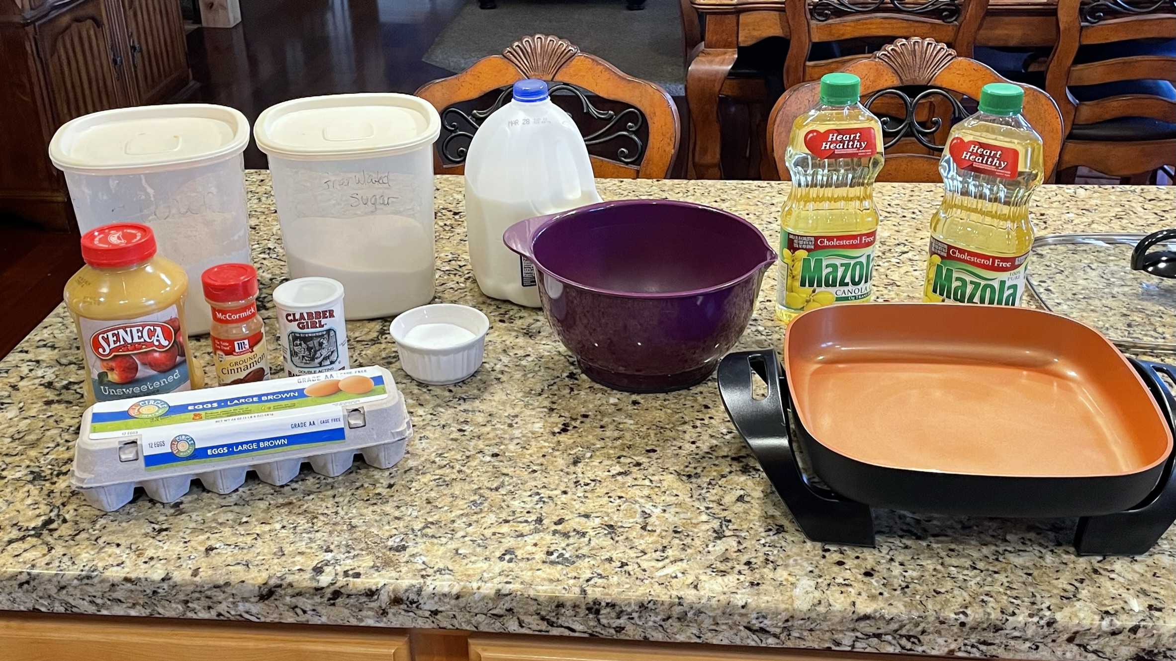 Ingredients and cooking utensils laid out for making Apple Cinnamon Sinkers