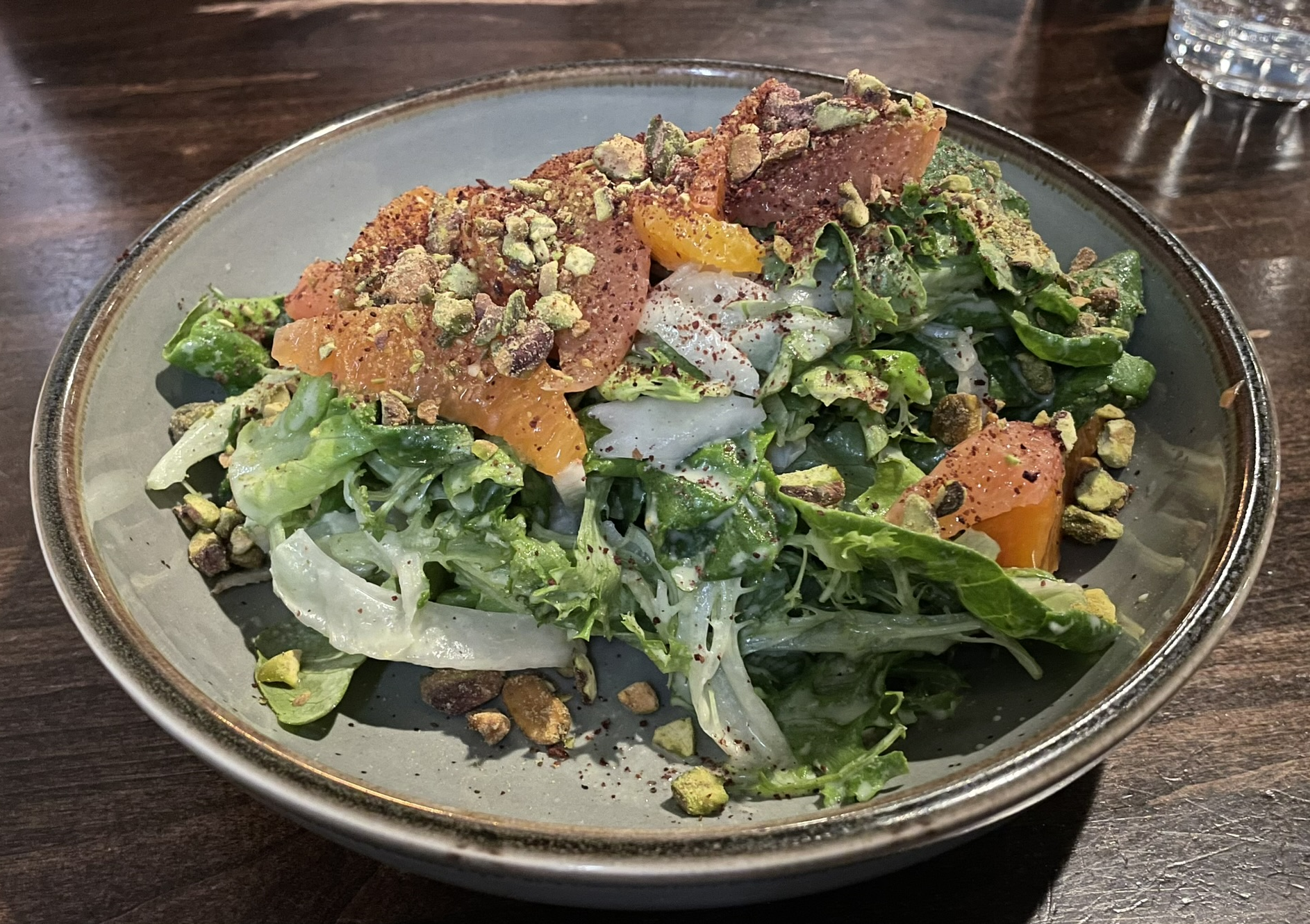 Salad with mixed greens, fennel, citrus, pistachio, yogurt-mint dressing, and sumac at the Block Restaurant