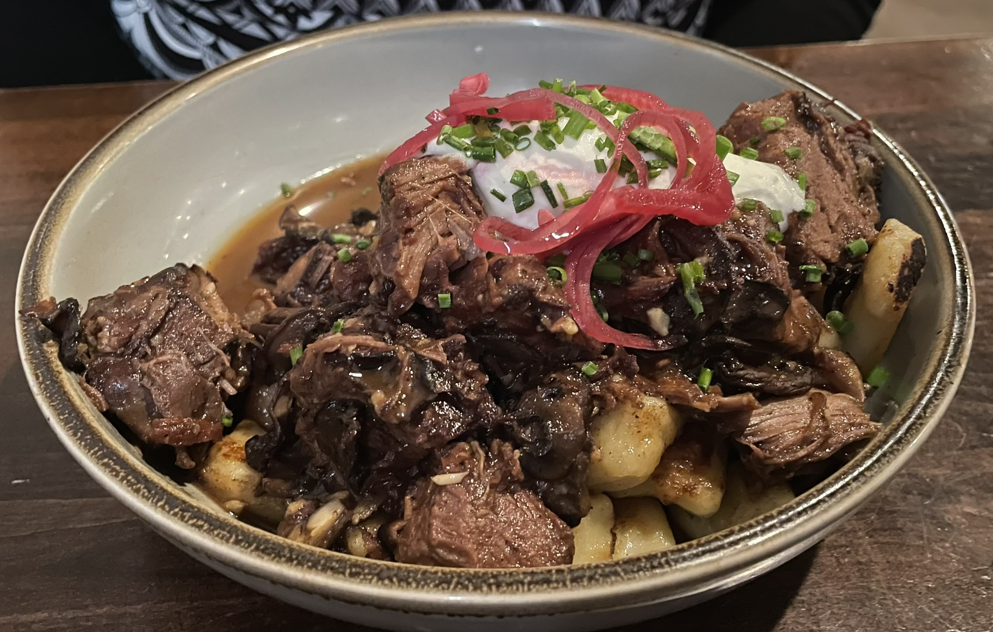 House made potato gnocchi with braised short rib, roasted mushrooms, crème fraîche, and pickled shallots