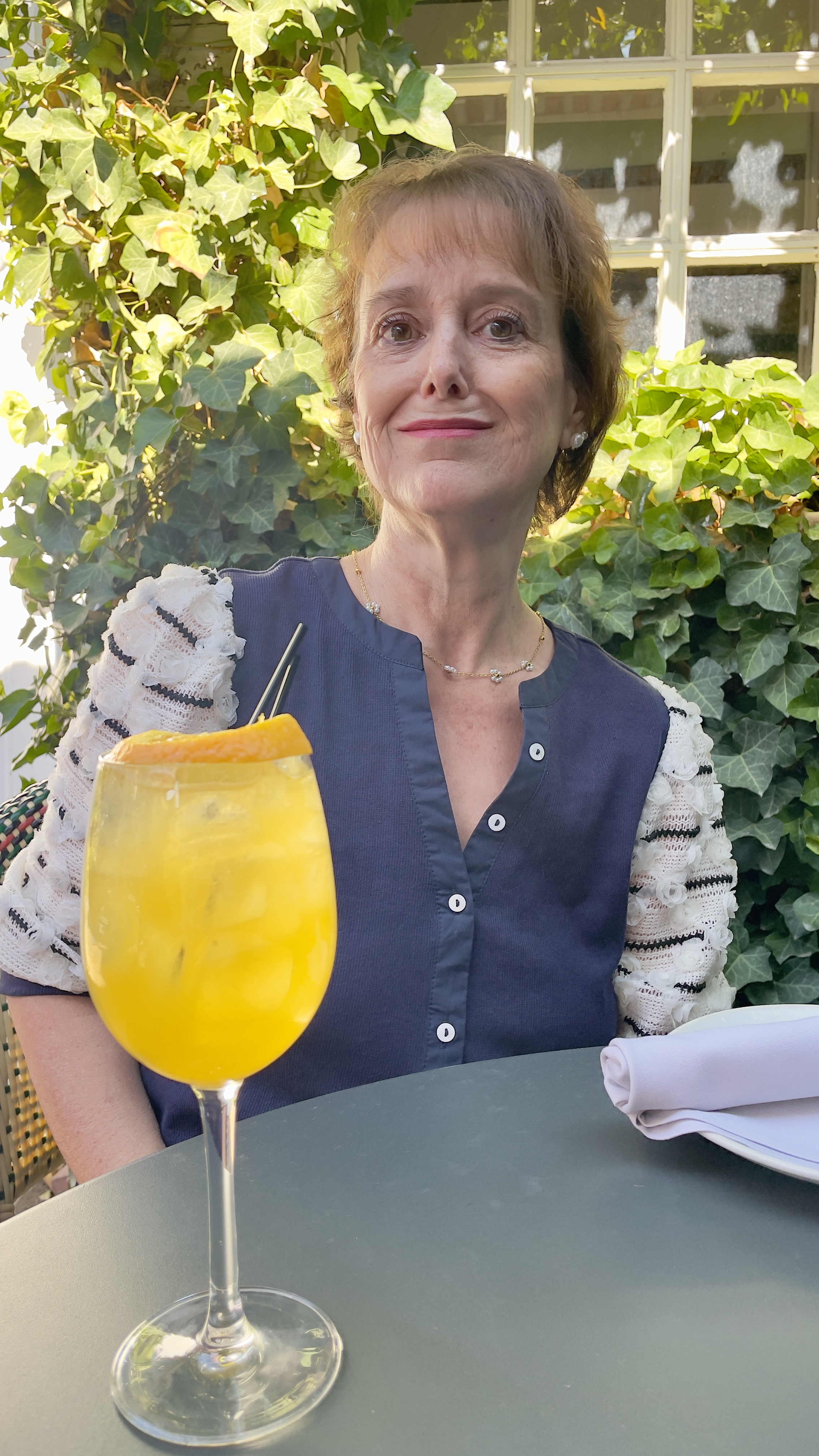 Kathy prepares to enjoy her bespoke beverage, the Mocktail Roulette, at Finca.