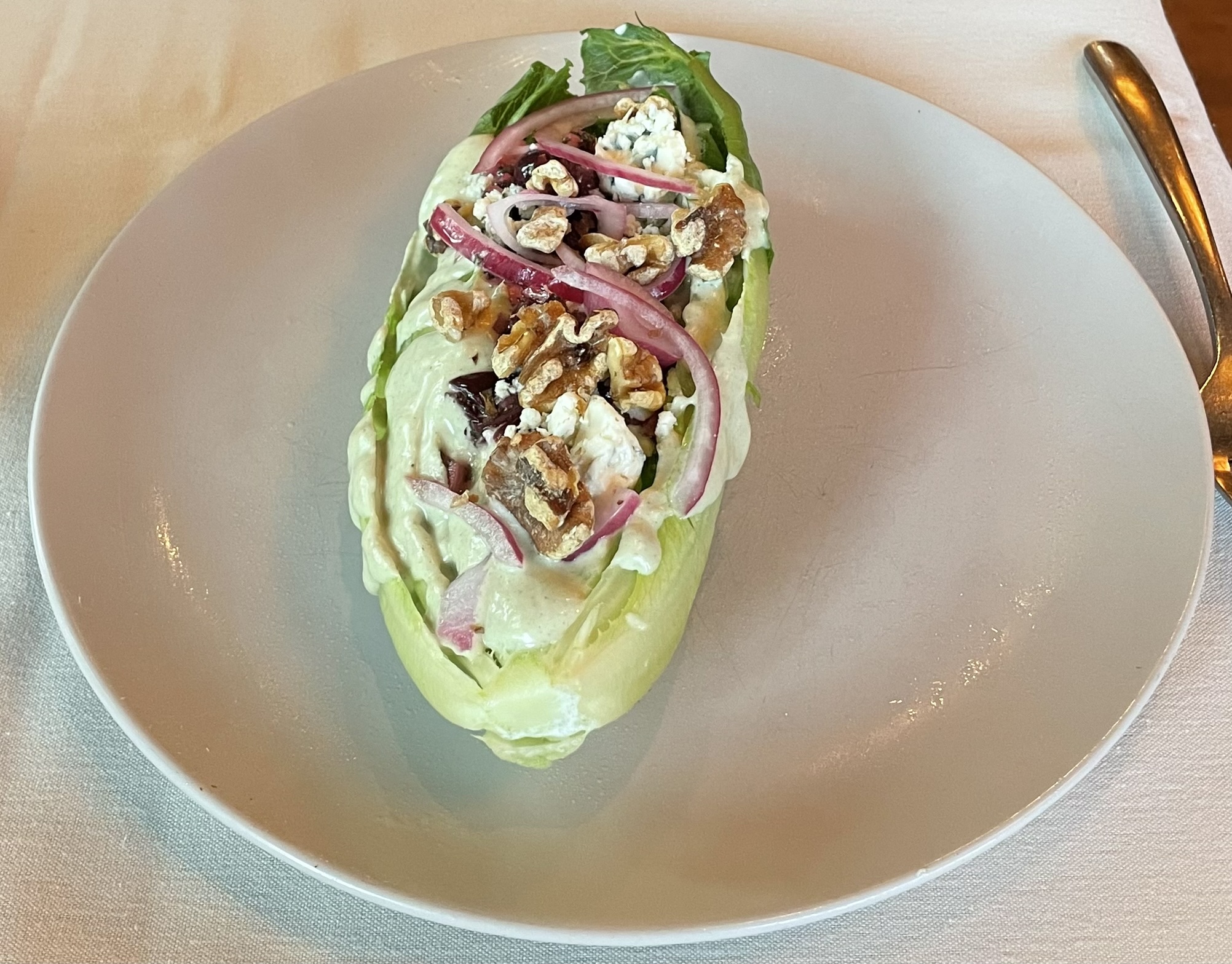 Artisanal Romaine Salad at Franck's Restaurant.  Cherry-fennel gremolata, gorgonzola, pickled onion, walnuts, gorgonzola-mint dressing.