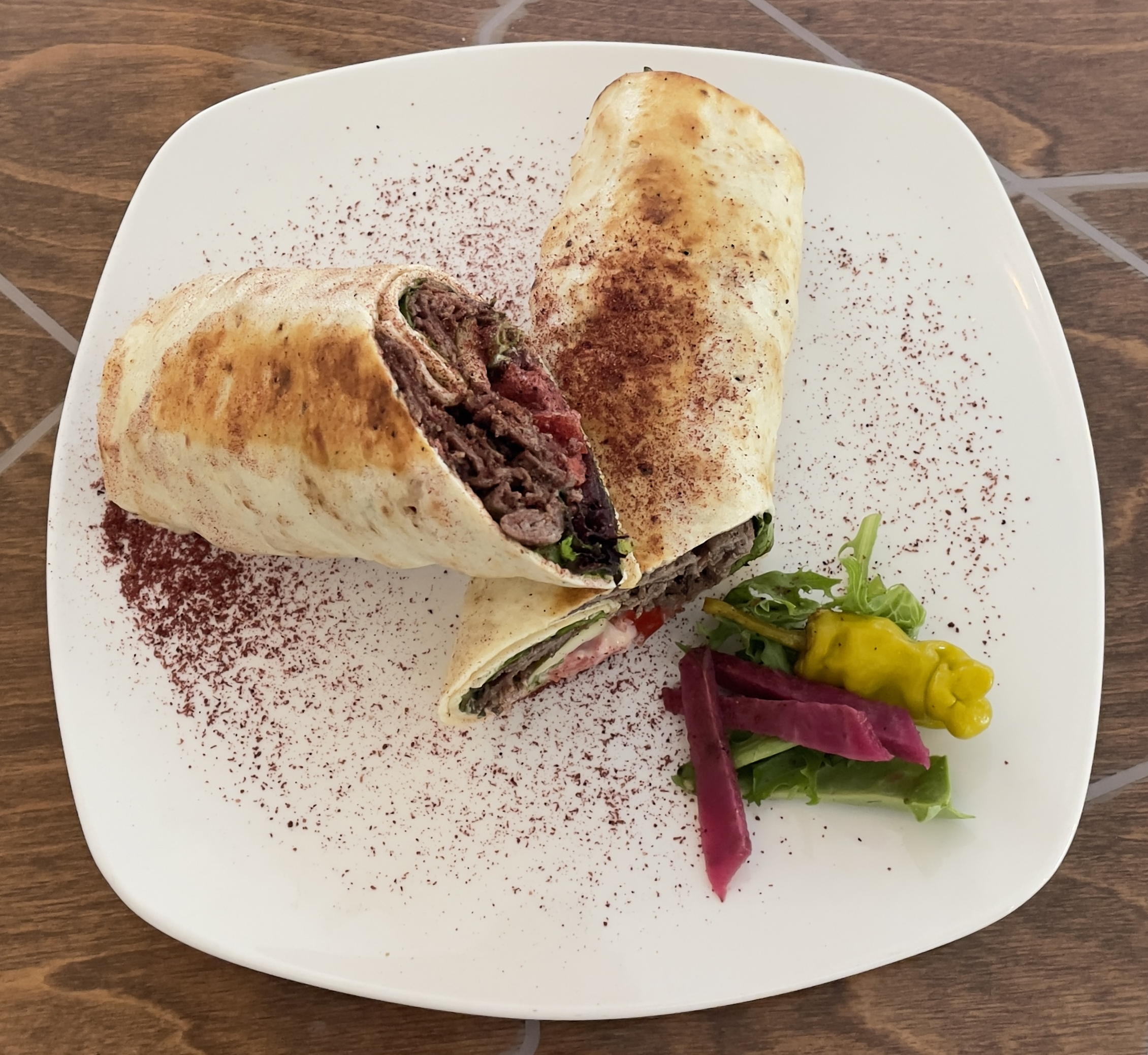 Beef Shawarma at Layla Mediterranean Grill and Mezze.  Tender thin slices of top sirloin, marinated in a special blend of Mediterranean spices and extra virgin olive oil.  Grilled and served with tahini sauce.