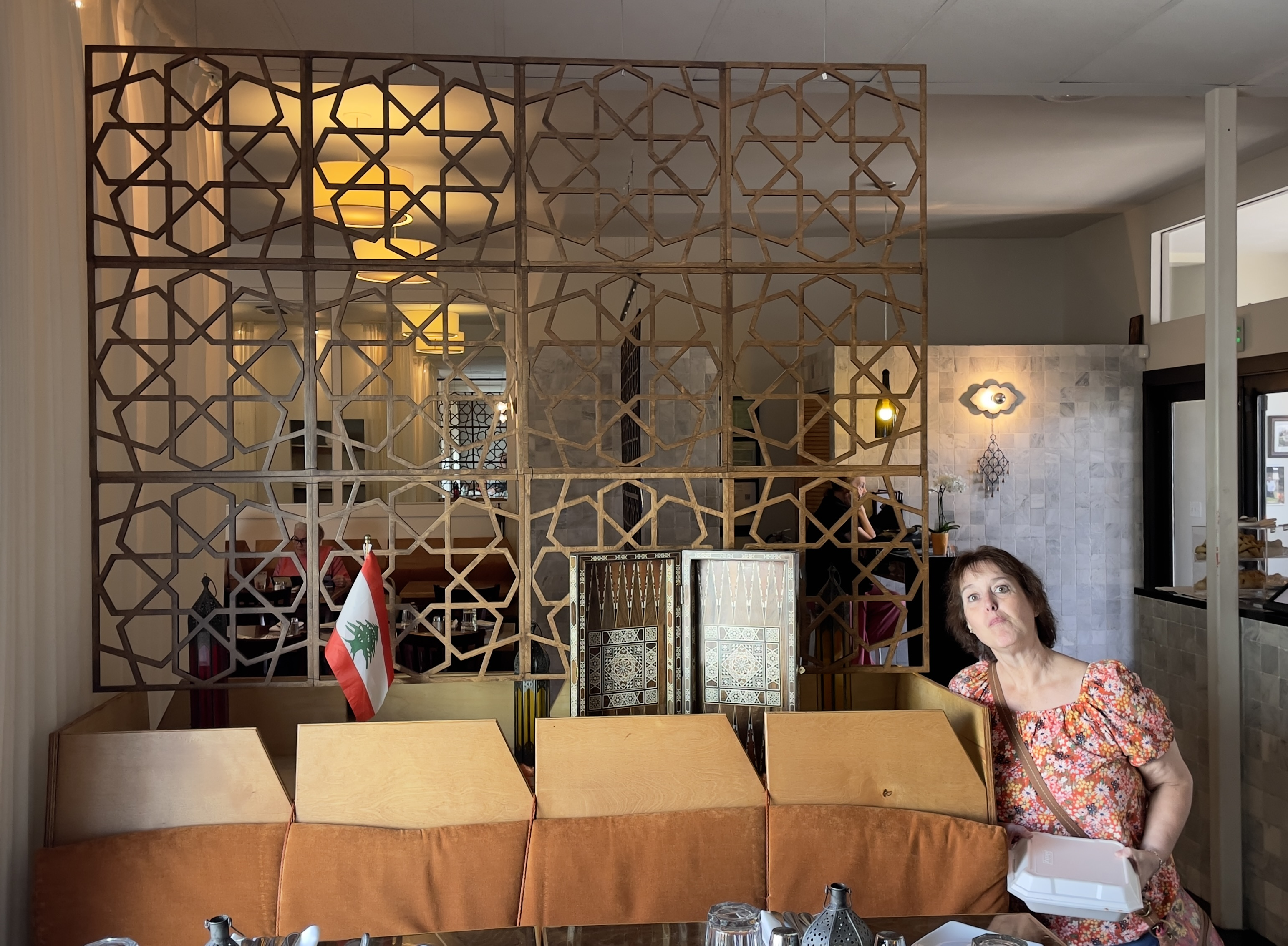 Kathy poses near a Rub el Hizb partition, a “geometric Arabesque” at Layla Mediterranean Grill and Mezze.