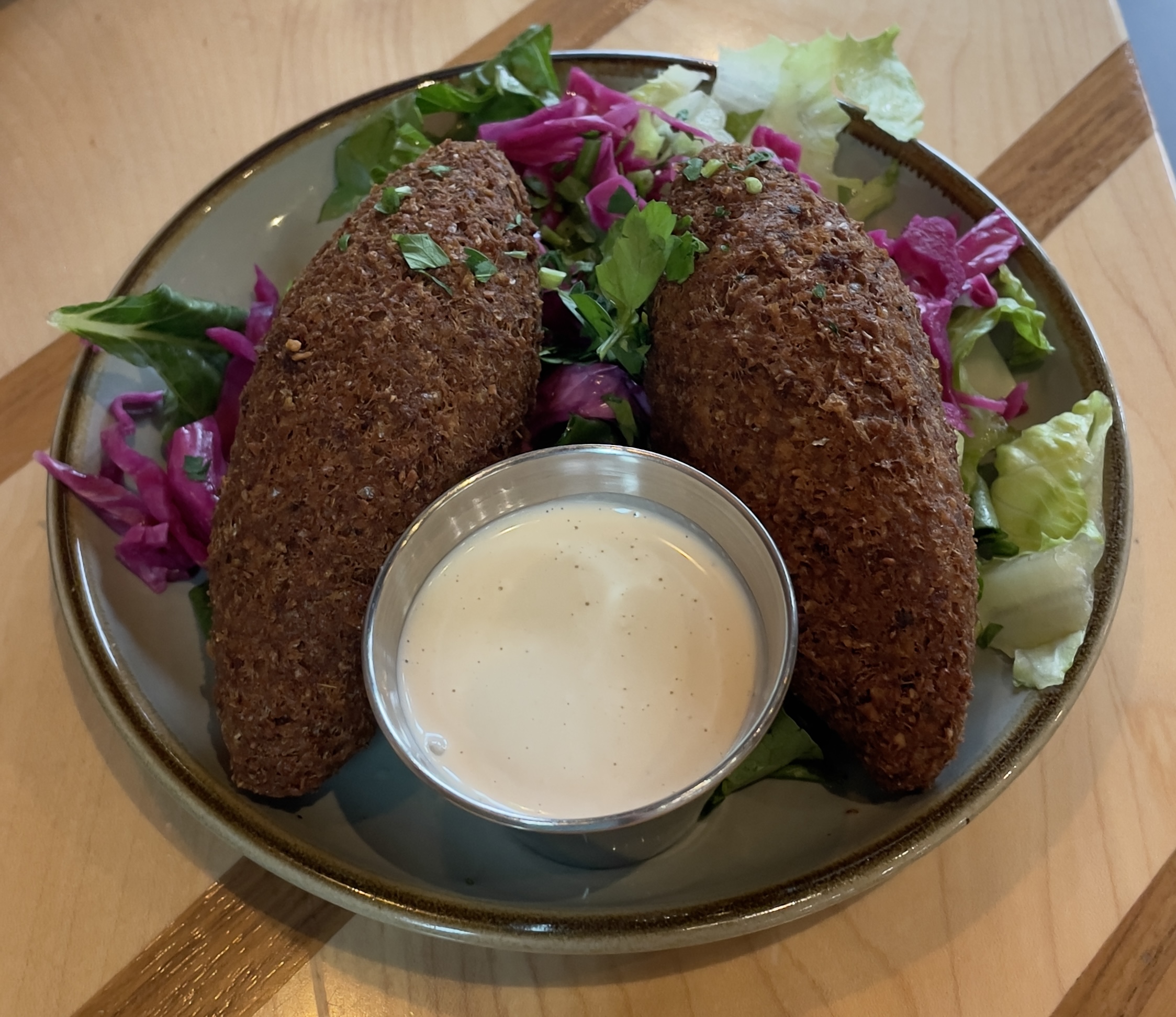 Kibbeh Mezze at Laziz Kitchen.  The National dish of Lebanon, and featured on Diners, Drive-In’s, and Drives.  Handmade dough stuffed with beef and then fried.