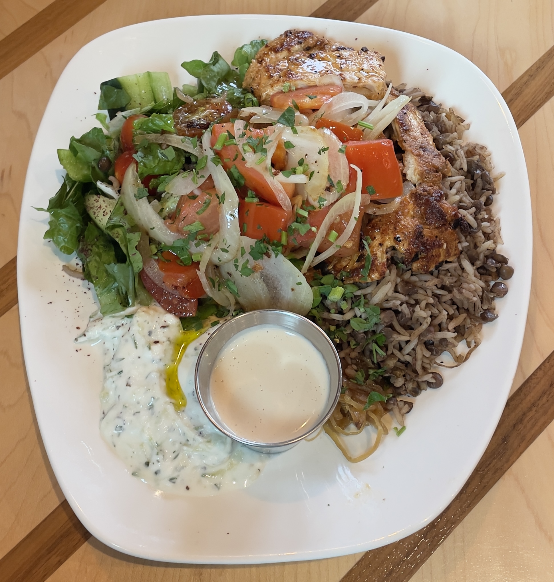 Lebanese Platter at Laziz Kitchen.  Lebanese rice & lentils, yogurt tzatziki, house salad and caramelized onions.