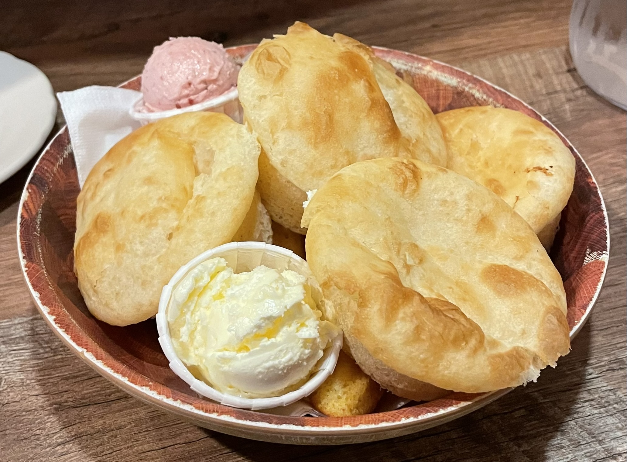 A bowl of fresh-made rolls with raspberry butter at Maddox Ranch House