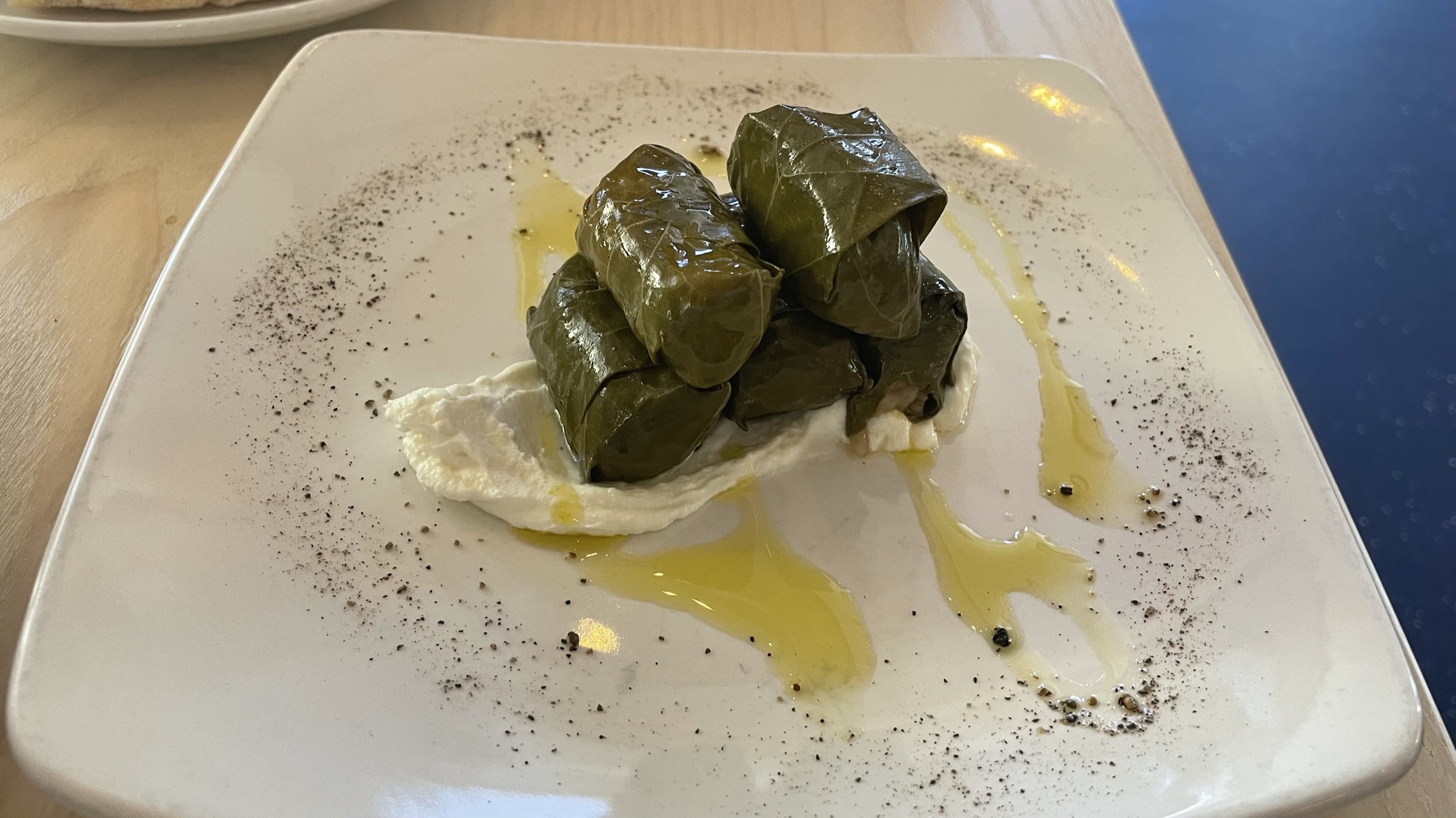 Dolmades (stuffed grape leaves) on a plate