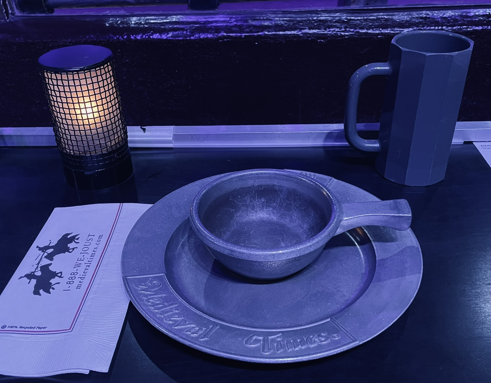 The place setting—plastic goblet, pewter bowl and plate—at Medieval Times in Buena Park, California