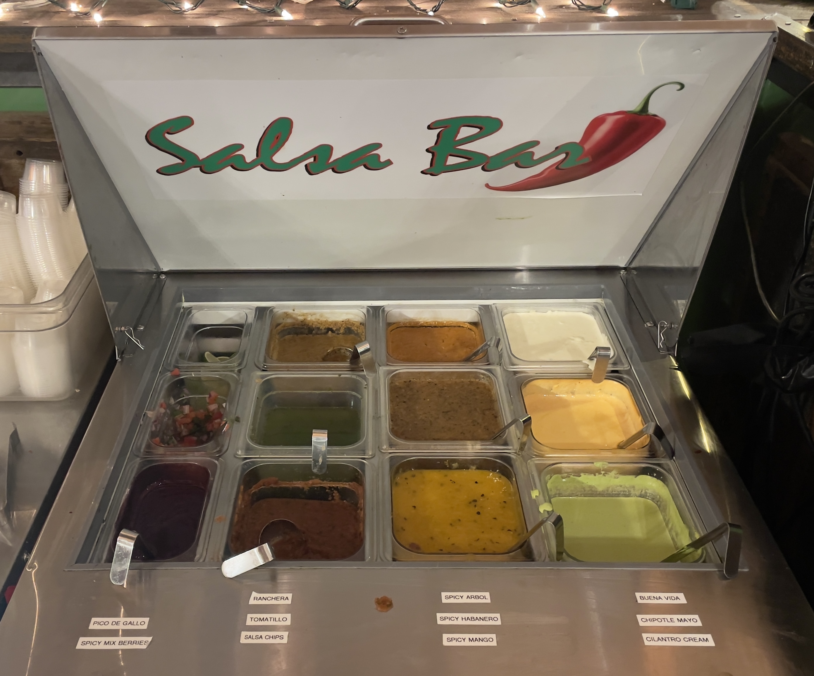 Self-serve salsa bar at Mi Buena Vida.  A dozen varieties of salsa.