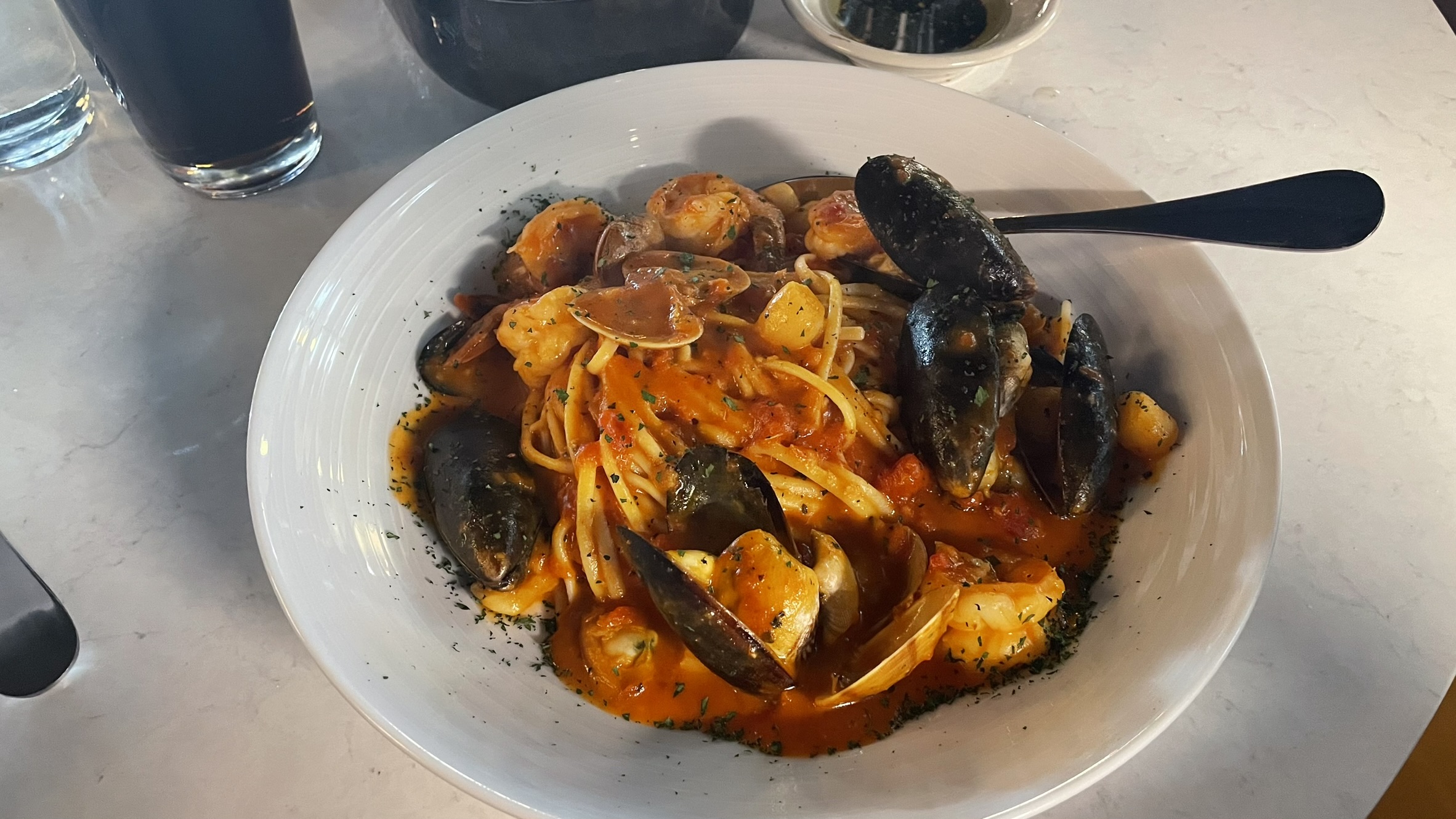 Frutti Di Mare: Shrimp, mussels, clams, and scallops in marinara sauce with linguine pasta