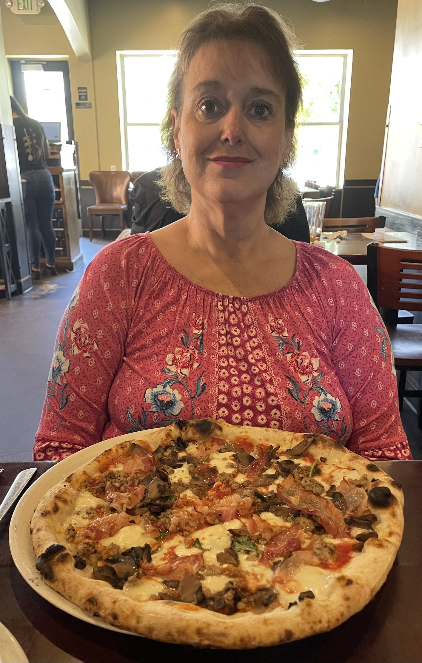 Kathy prepares to enjoy her Settebello pizza at Settebello Pizzeria Napoletana