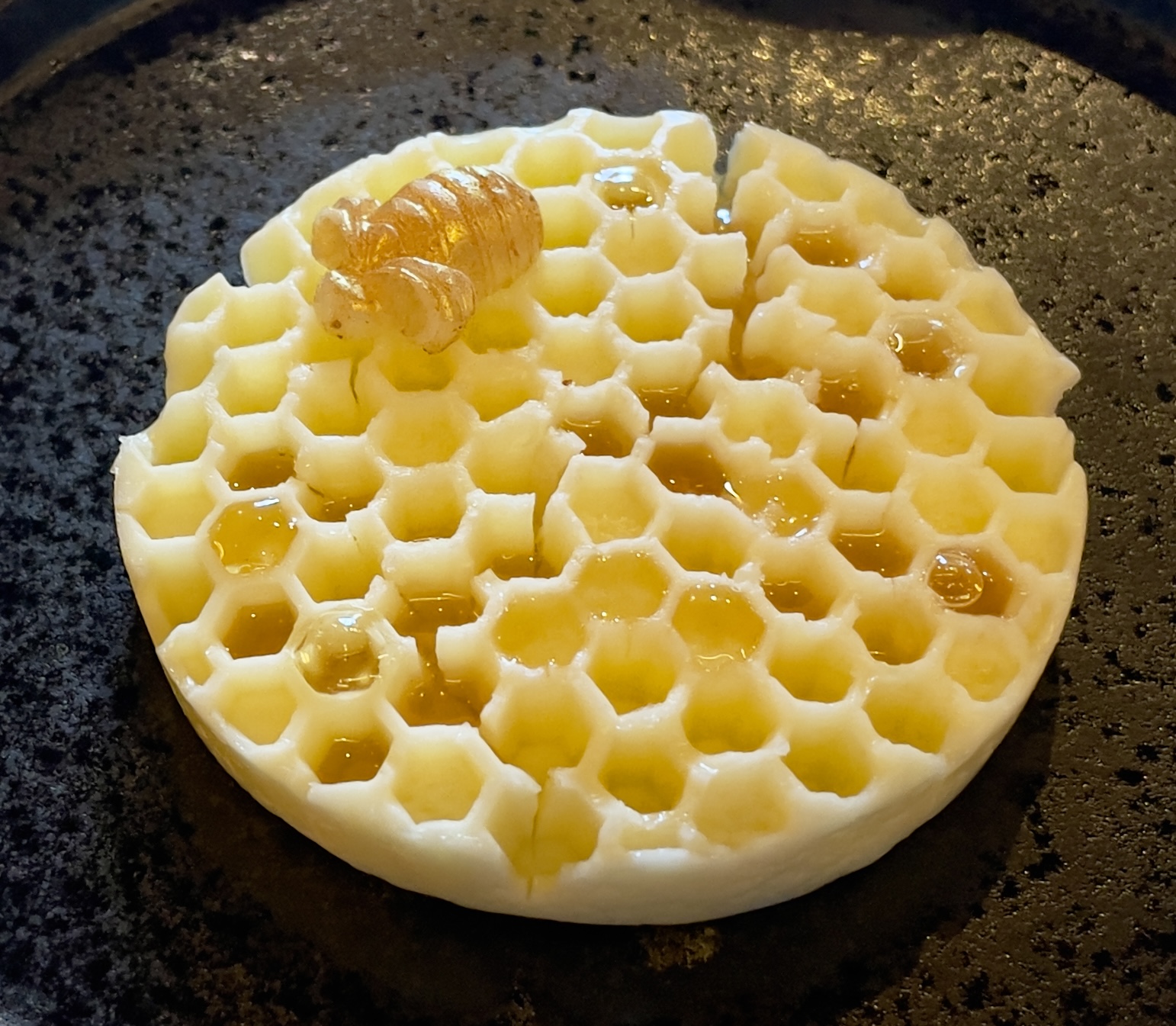 Softened butter molded like honeycomb, drizzled with honey at the Tree Room.