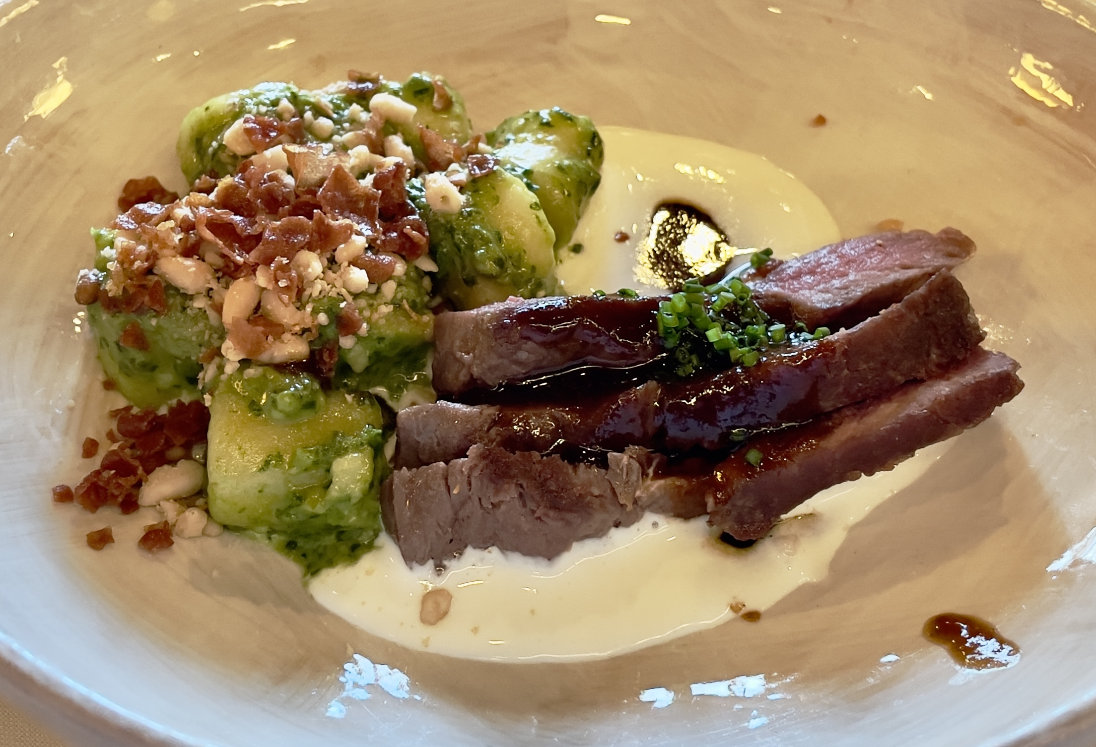Lamb Loin at the Tree Room: Ricotta gnocchi, cucumber, corn, tomatoes, avocado vermicelli crisp.