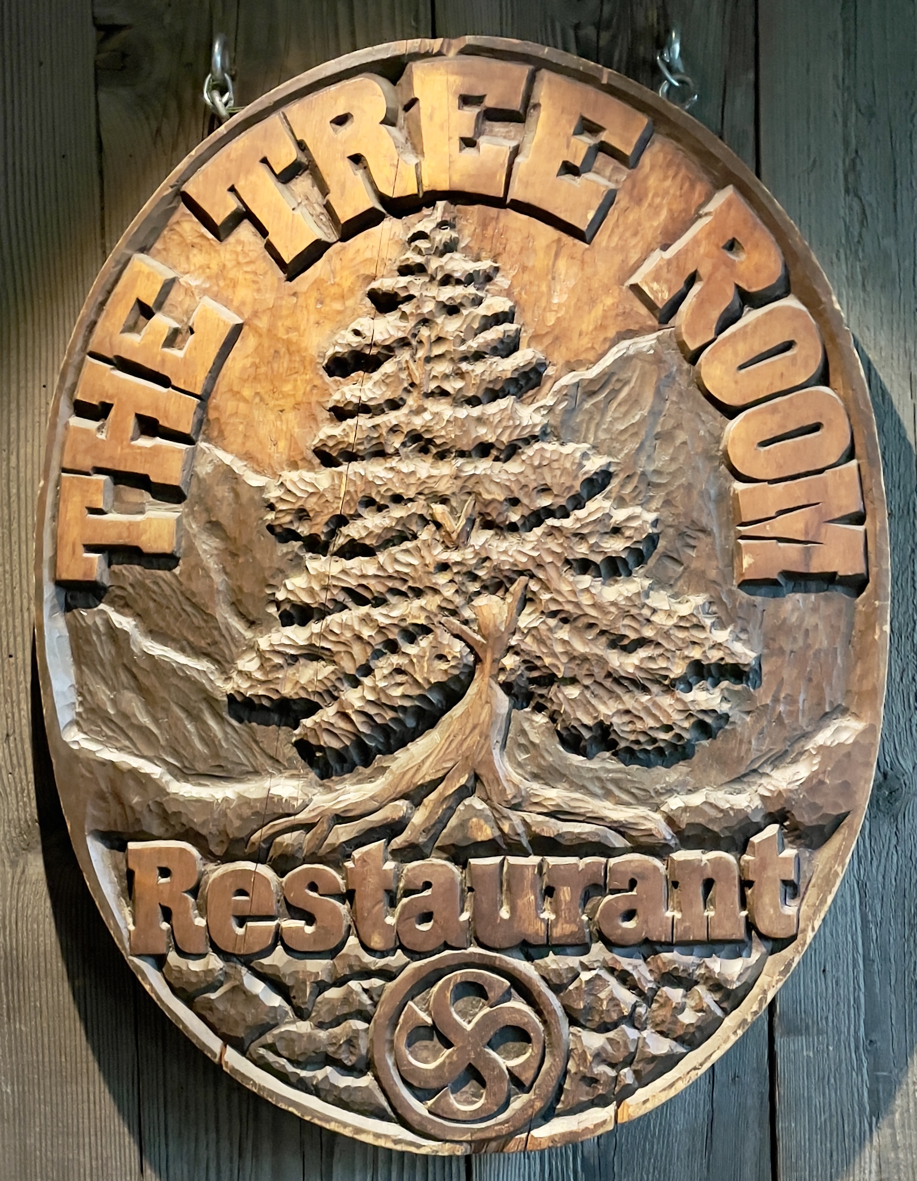 A relief carving welcomes visitors to the Tree Room.