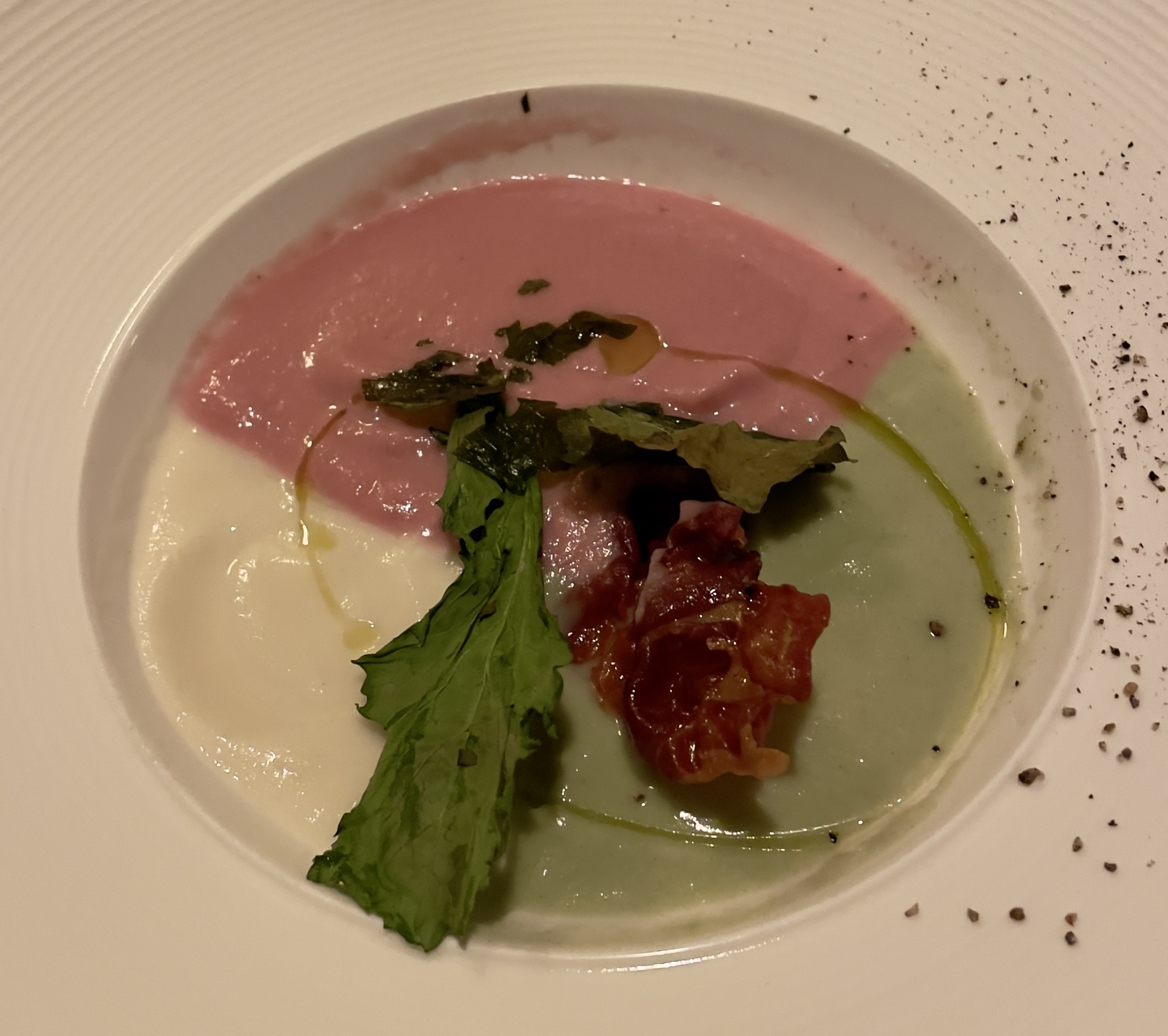 Multicolor cauliflower satin soup with crispy speck and kale chips at Veneto Ristorante Italiano.