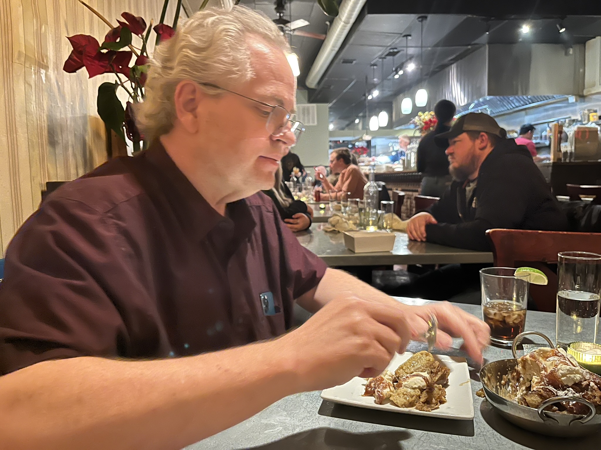 Brian samples the bread pudding (brown butter and bourbon, vanilla ice cream, and caramel) on his birthday at Wildwood Restaurant.