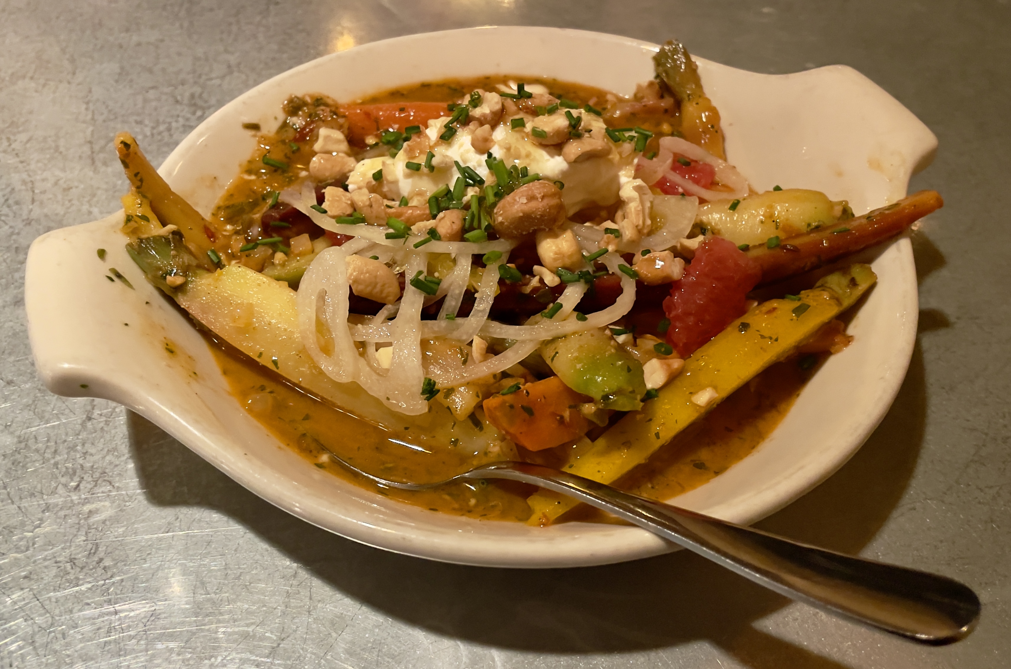 Moroccan carrots with charmoula, cashews, wildflower honey, pickled onion, crema, and citrus at Wildwood Restaurant.